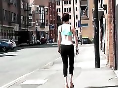 Sporty babe walks the streets in her workout clothes