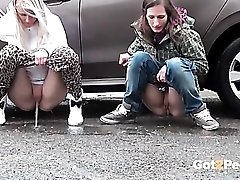 Two girls drop their pants and pee in public
