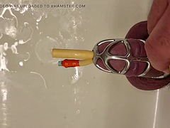 Pissing with a catheter locked in a chastity cage