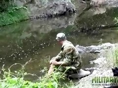 Two military lads resting by the river