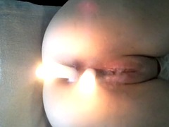 EXTREME - Two candles one in her pussy and one in her ass