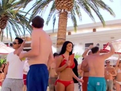 Party voyeur finds a slender brunette in a sexy red bikini