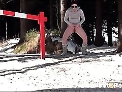 Busty sweater girl pees in the snow
